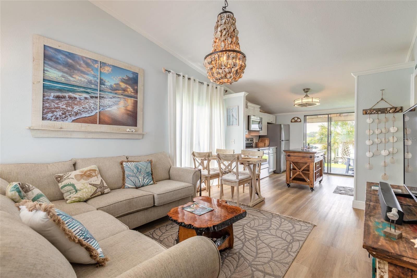 Living dining kitchen open to water view - 76 HEATHER POINT CT, NEW SMYRNA BEACH