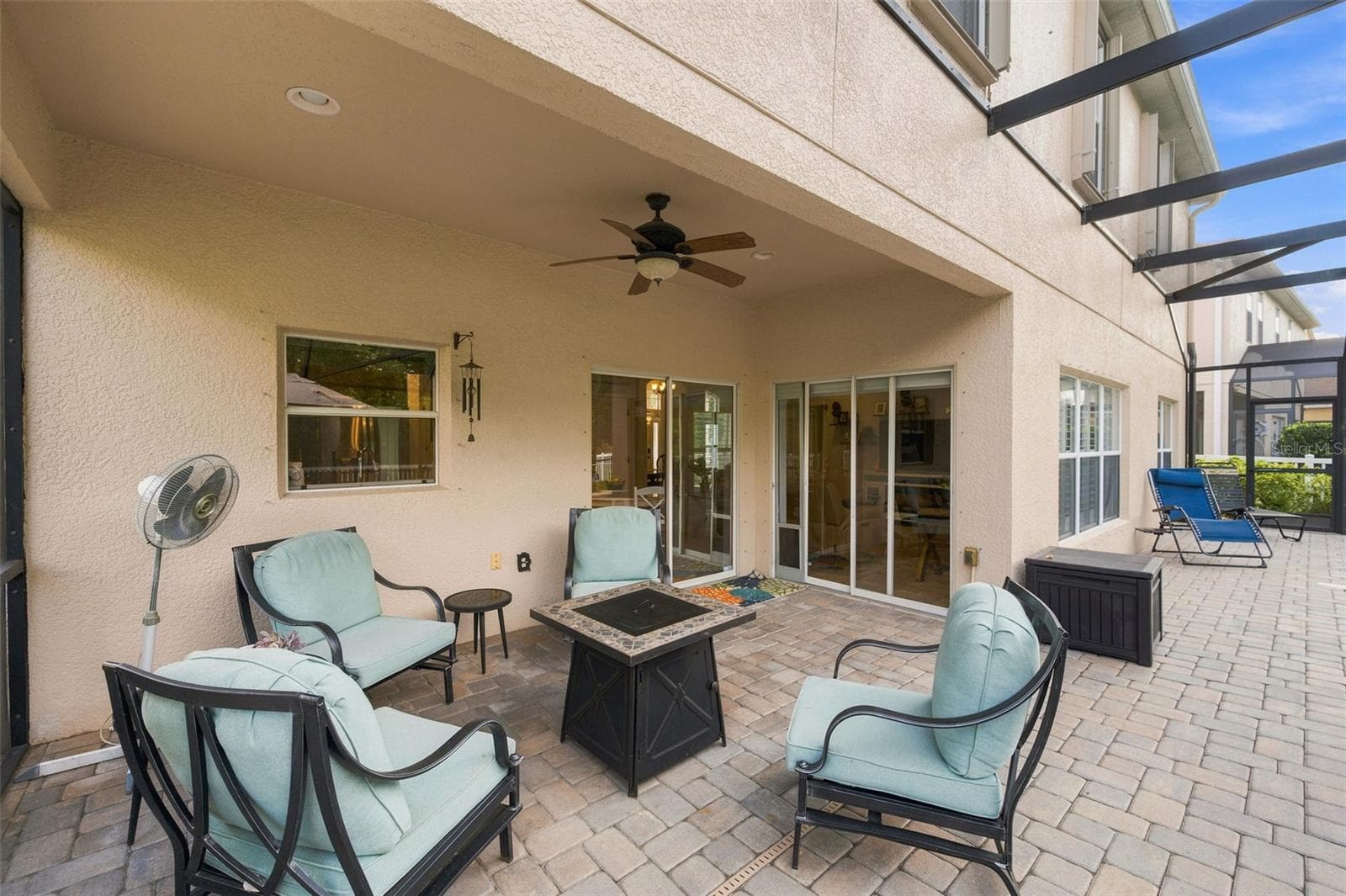 Covered patio area with fan. - 11507 BELLE HAVEN DR, NEW PORT RICHEY