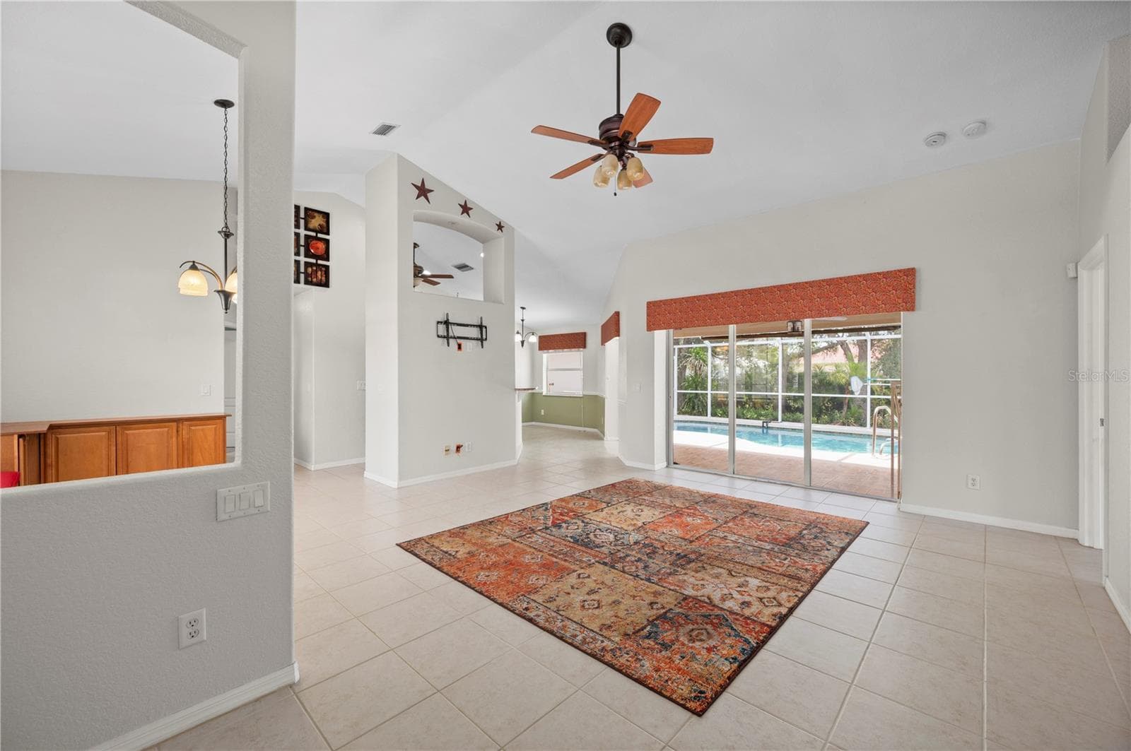 From entry step into the living room and out to the pool. - 5615 MOJAVE AVE, NORTH PORT