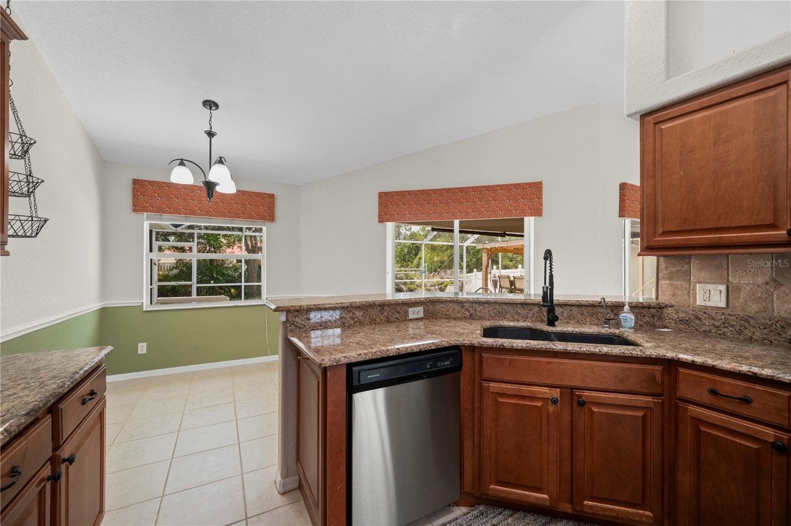 Kitchen and eat in area overlooking the pool. - 5615 MOJAVE AVE, NORTH PORT