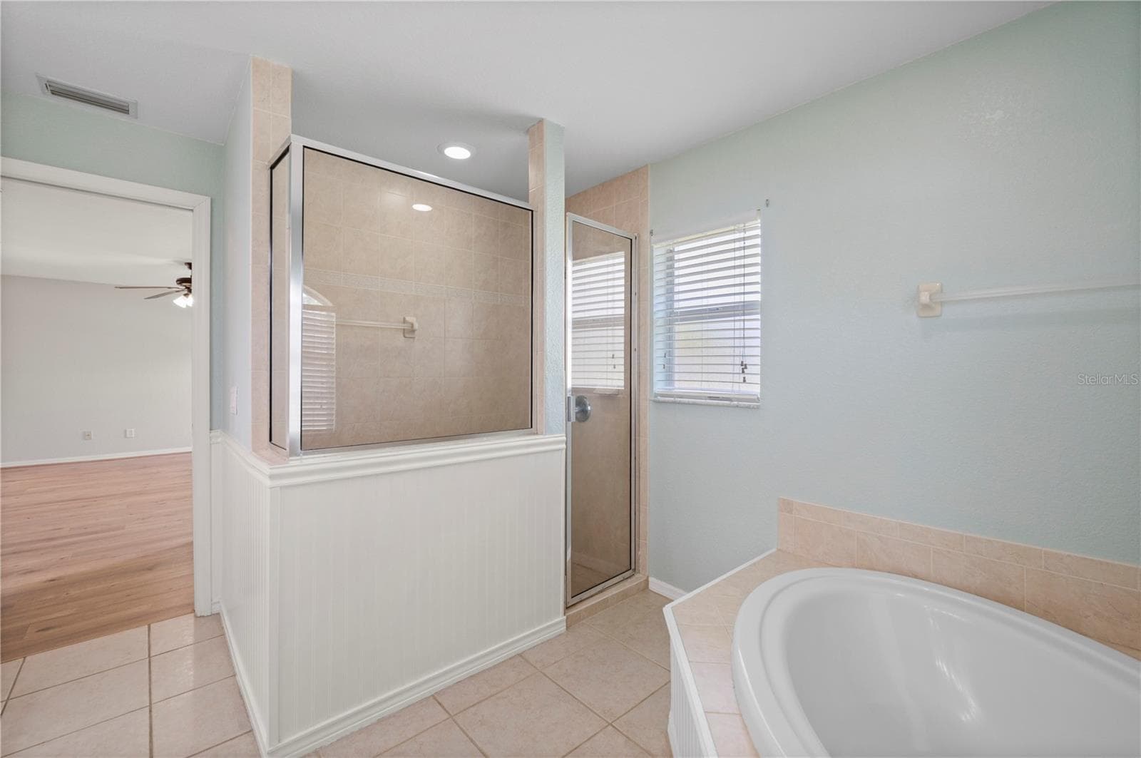 Primary bathroom features separate tub and walk in shower - 5615 MOJAVE AVE, NORTH PORT