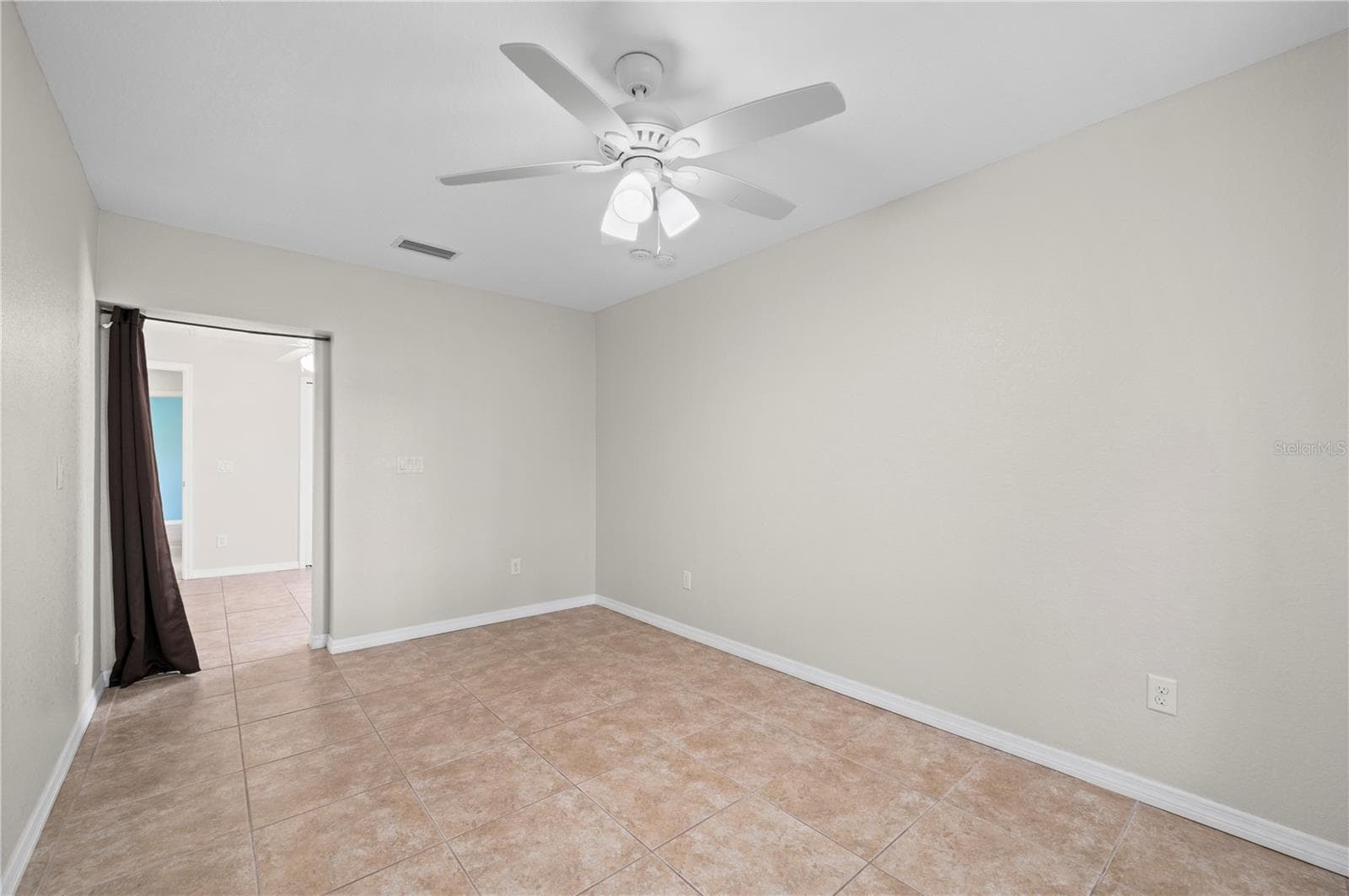 From this bonus room into Bedroom Three - 5615 MOJAVE AVE, NORTH PORT