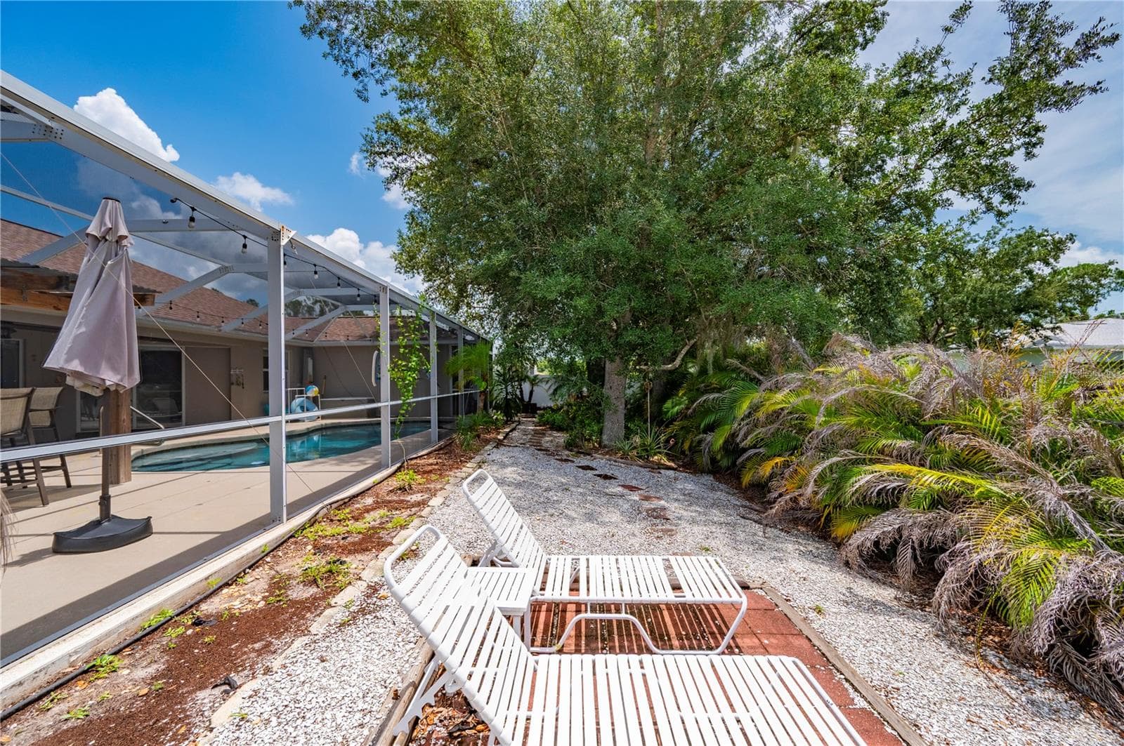 Relaxing in the backyard, dip in the pool. - 5615 MOJAVE AVE, NORTH PORT