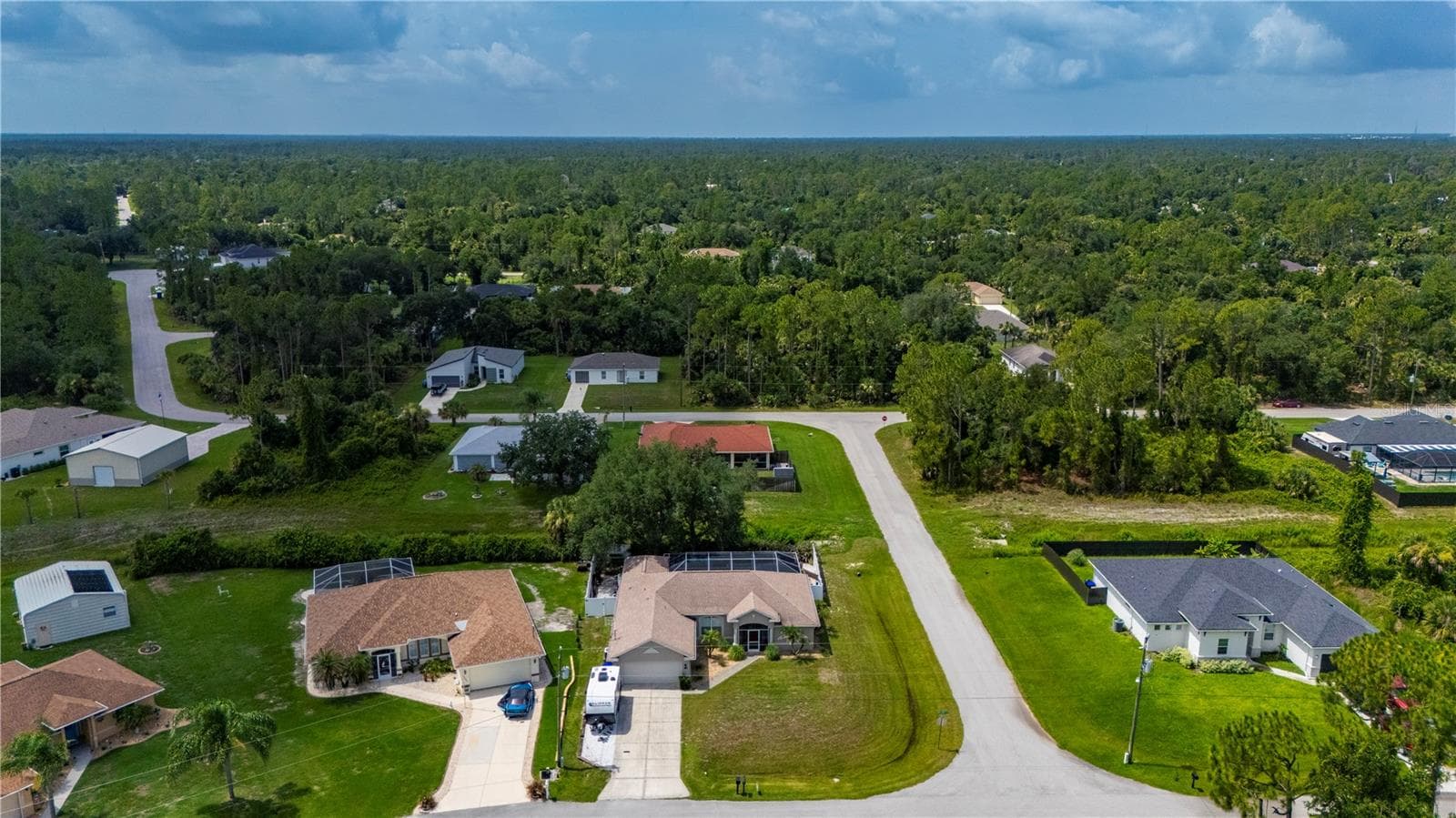 Aerial view of this pool home on a corner lot. - 5615 MOJAVE AVE, NORTH PORT