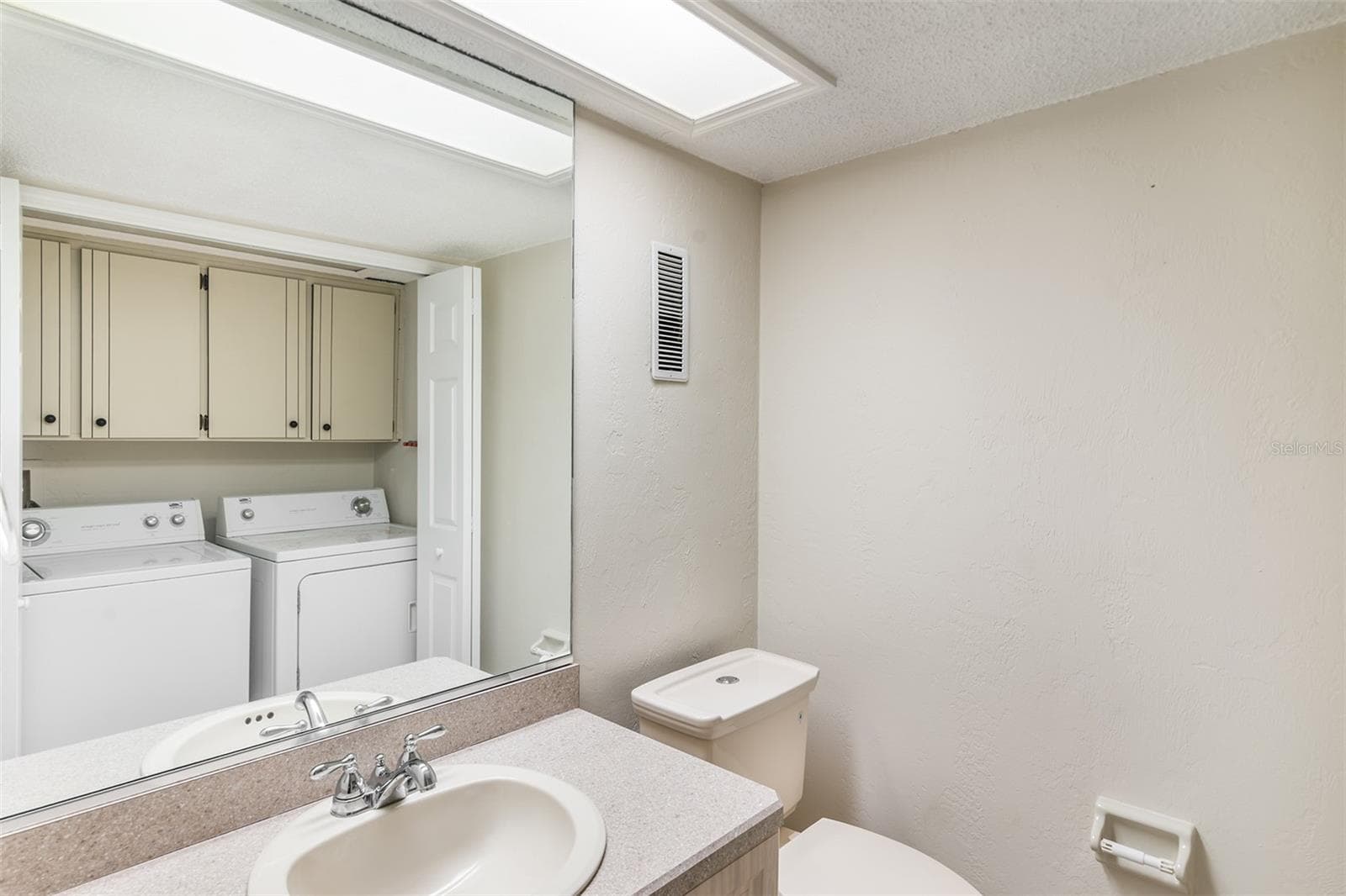 Powder Room/Laundry Room - 2600 OCEAN SHORE BLVD #111, ORMOND BEACH