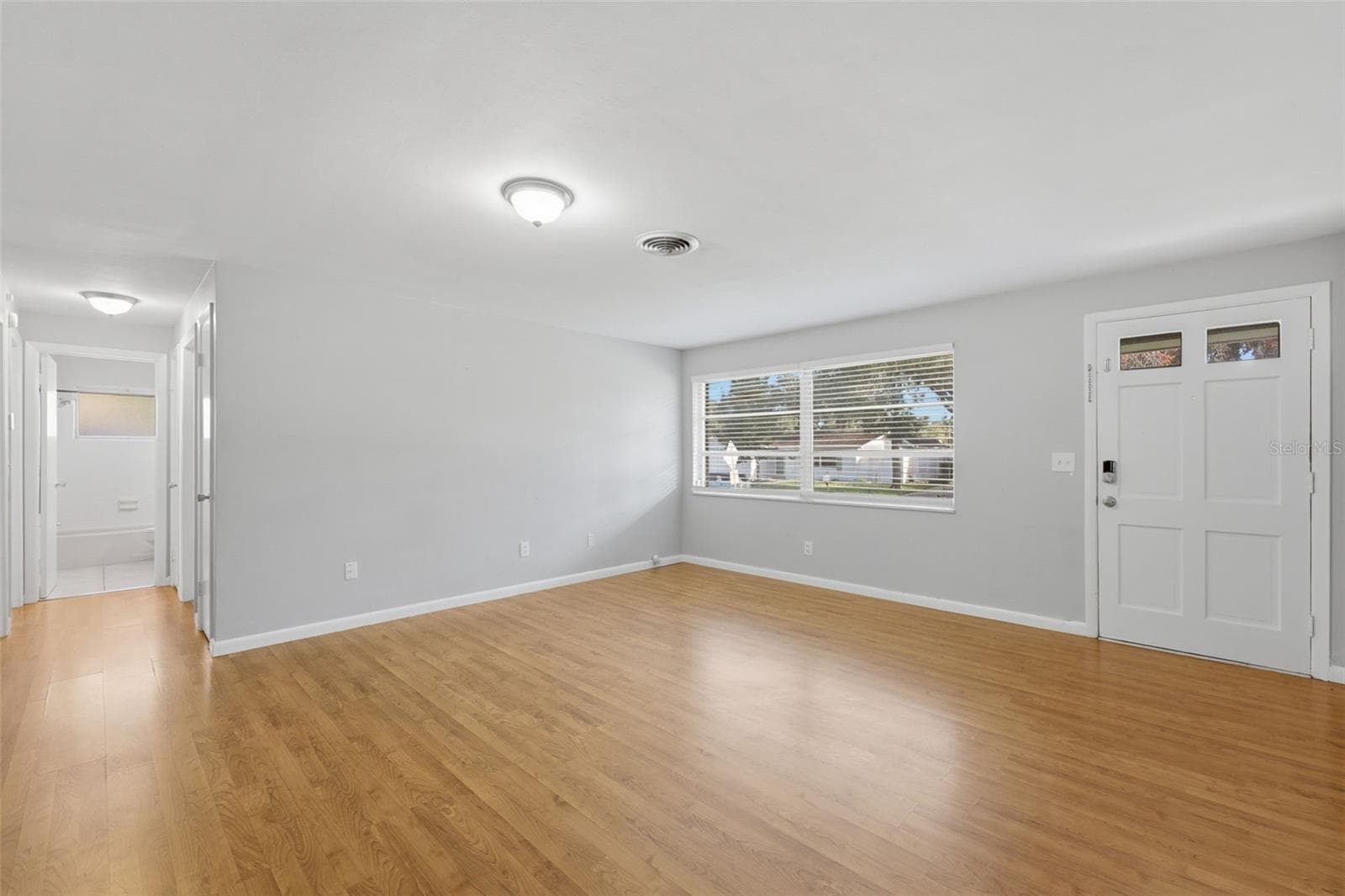 Front entrance, family room, and hallway to bedrooms - 1387 BELLEVUE BLVD, CLEARWATER