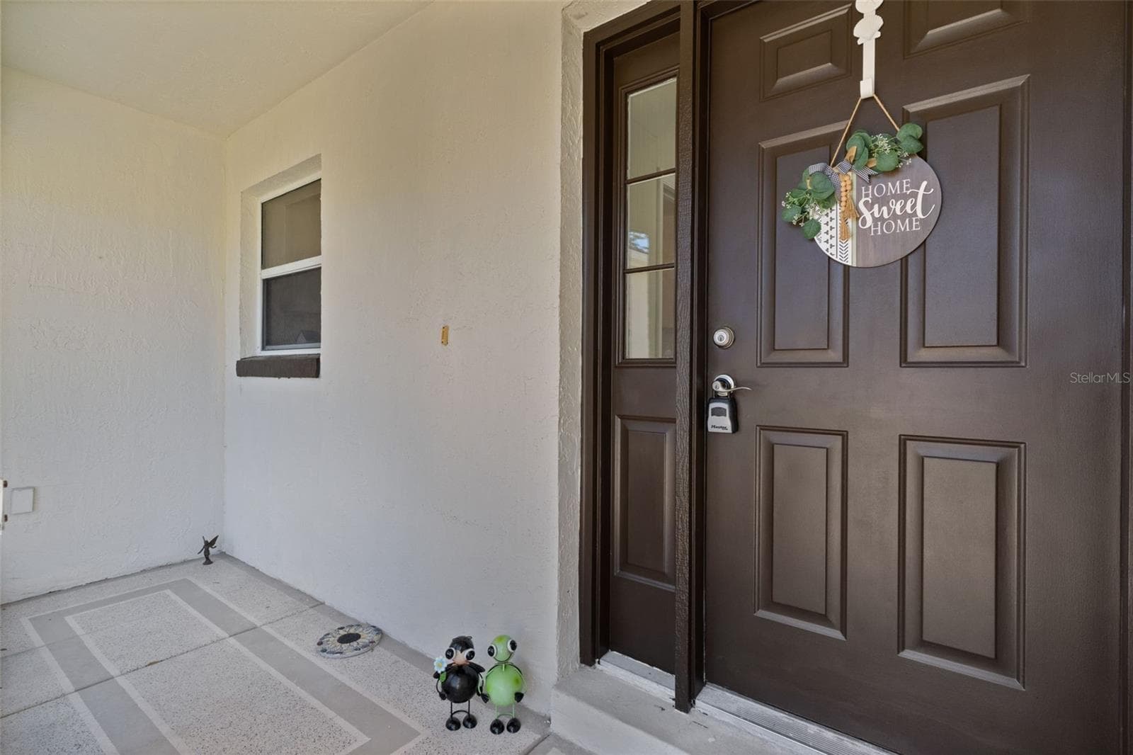 Enclosed front porch. Perfect for sitting outside afternoons if it rains. Don't you just love sitting outside and watching it rain. So relaxing! - 1012 DIEGO CT, LADY LAKE