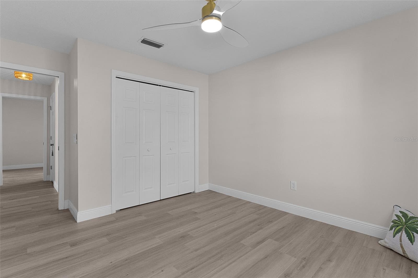Split floorplan design with primary bedroom on one side and guest wing with 2 more bedrooms and another bath on the other side. - 1012 DIEGO CT, LADY LAKE