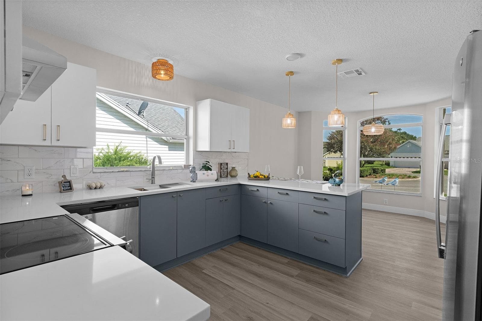 All new light fixtures, large sink, and faucet all elevated champagne gold. - 1012 DIEGO CT, LADY LAKE