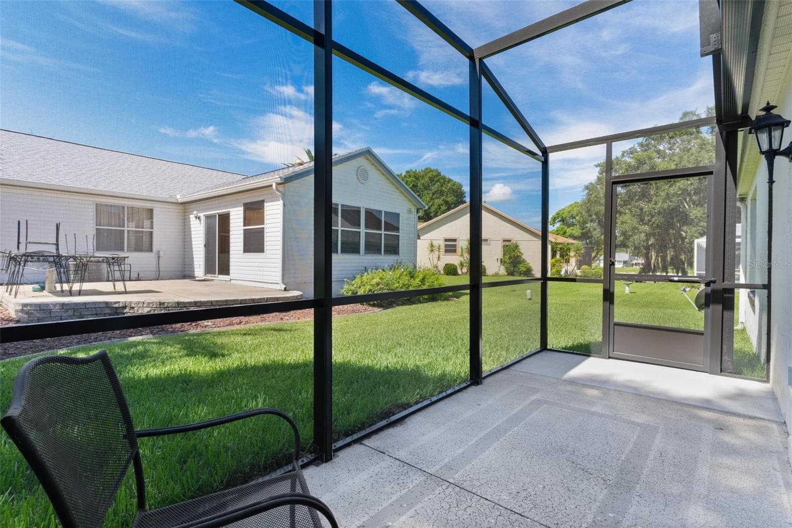 Brand new bird cage added with view of north side of Lady Lake - 1012 DIEGO CT, LADY LAKE