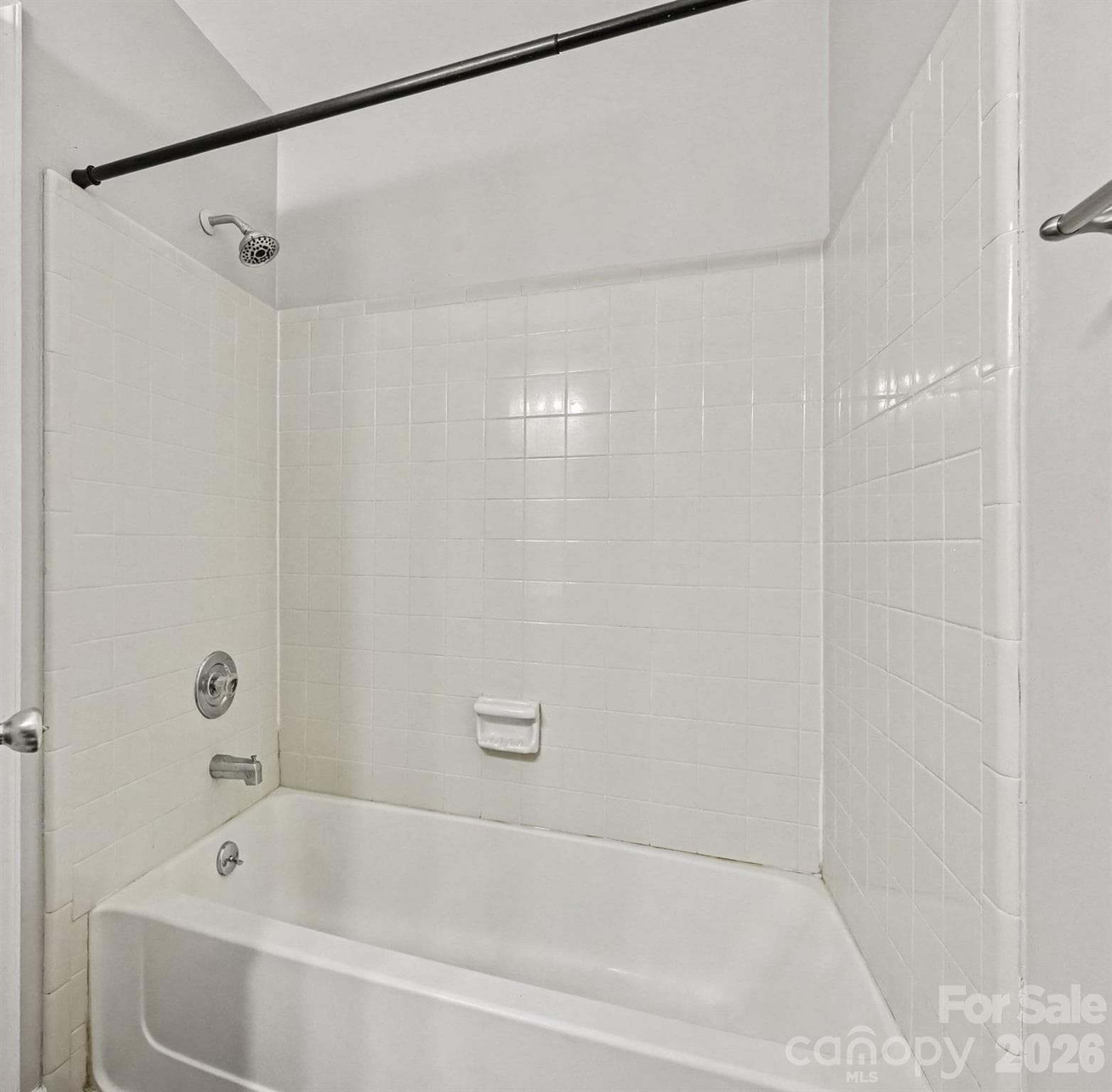 a large, tile surrounded tub/shower combination - 6165 Meadow Rose Lane, Charlotte