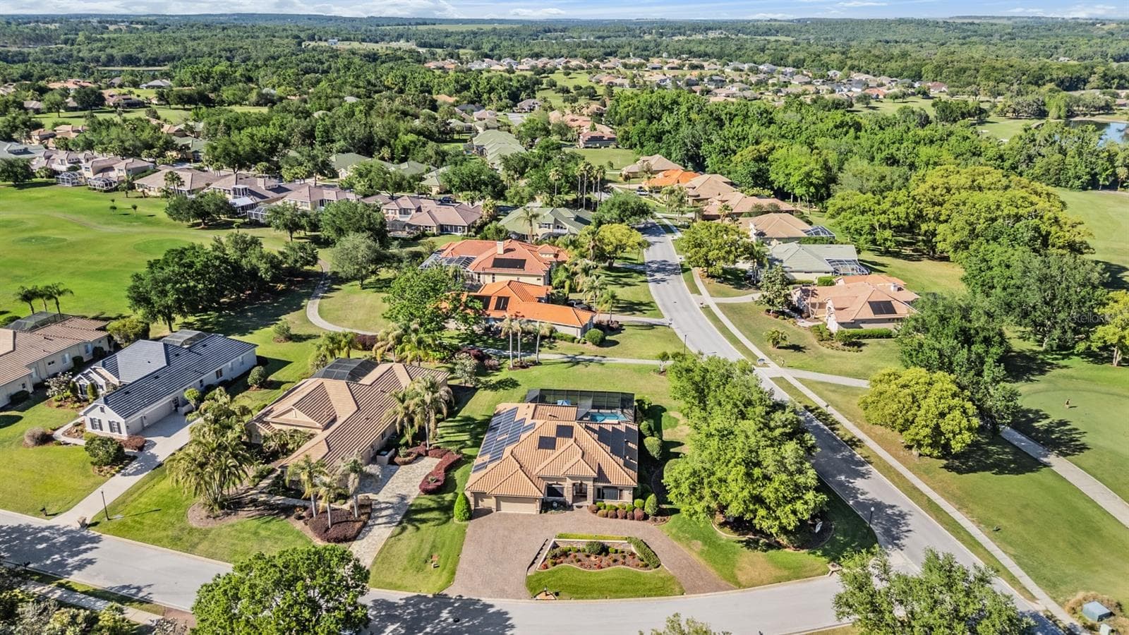 Oversized lot with greenspace behind, parklike setting on side and golf course views - 34115 AMERICANA AVE, DADE CITY