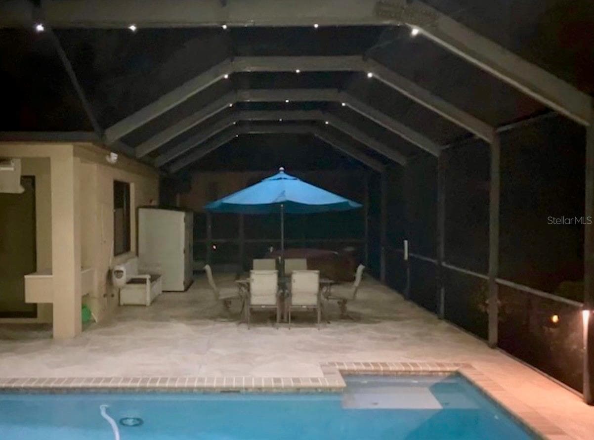 Lights on screen illuminate the space - 34115 AMERICANA AVE, DADE CITY