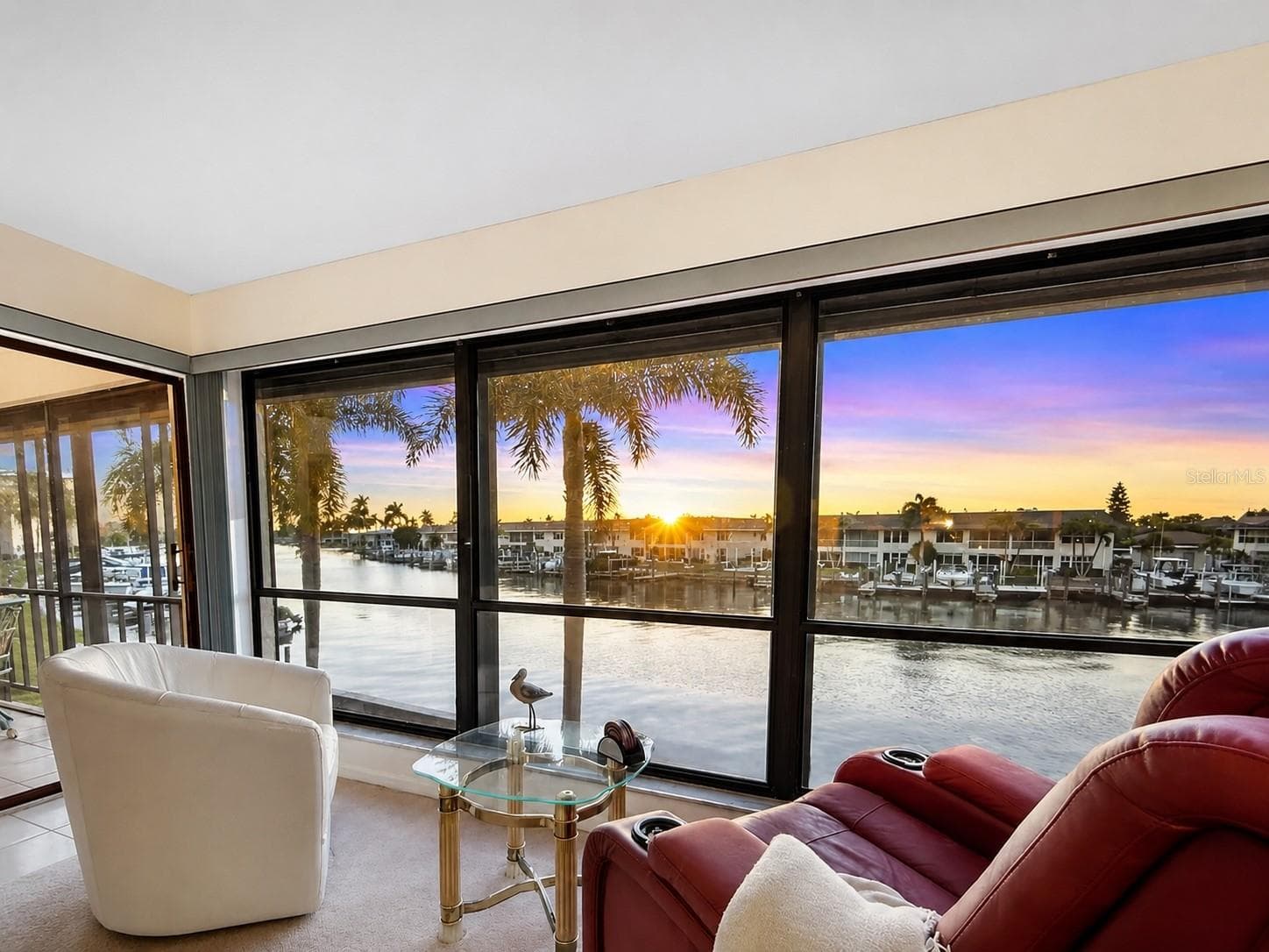 Brighten your evenings with serene WIDE WATER VIEWS and FRONT-ROW SUNSETS from the comfort of your living room - 4218 SE 20TH PL #D5, CAPE CORAL
