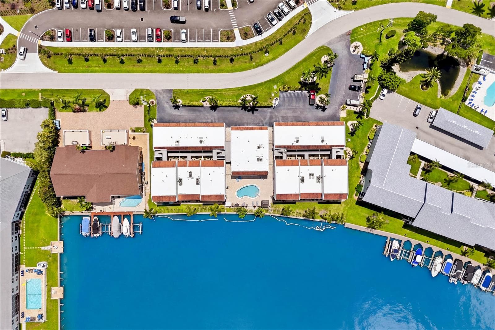Residents can unwind by CRYSTAL-CLEAR COMMUNITY POOL or enjoy the scenic, walkable surroundings of this BEAUTIFUL WATERFRONT COMMUNITY - 4218 SE 20TH PL #D5, CAPE CORAL