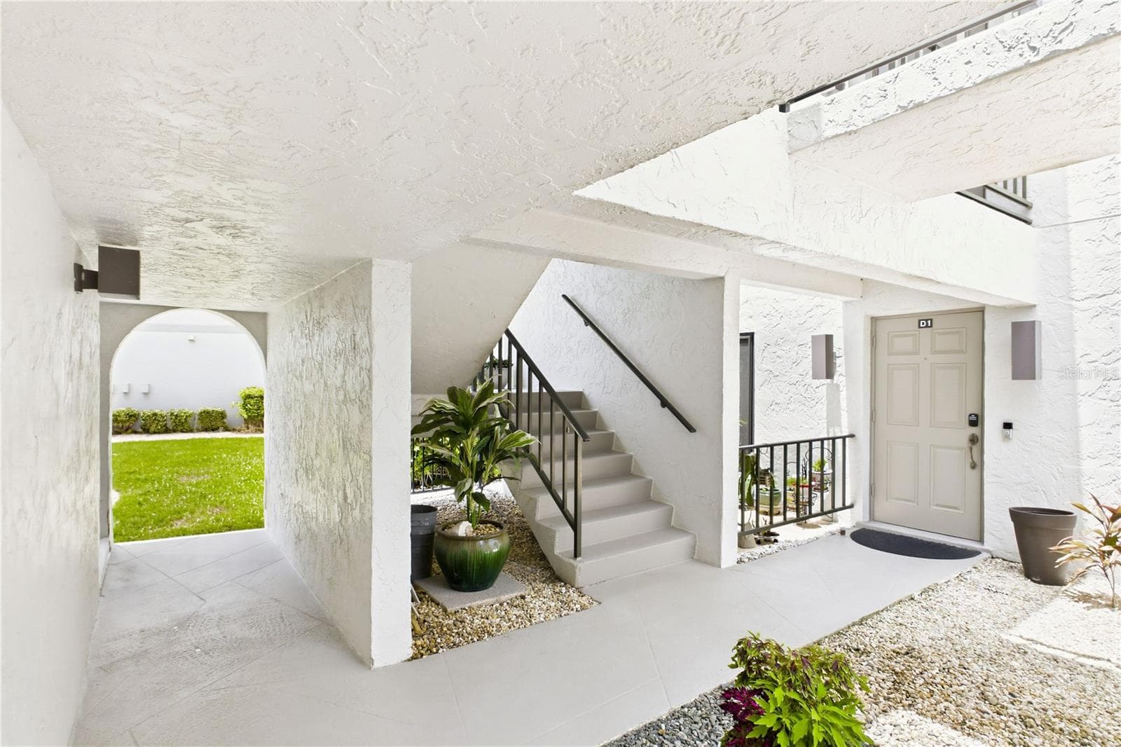 Covered stairway leading to the second-floor condo entrance - 4218 SE 20TH PL #D5, CAPE CORAL