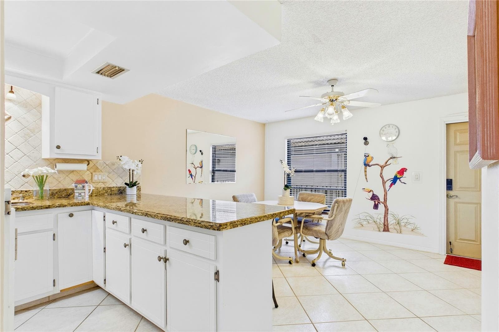 Granite countertops add warmth and durability throughout - 4218 SE 20TH PL #D5, CAPE CORAL