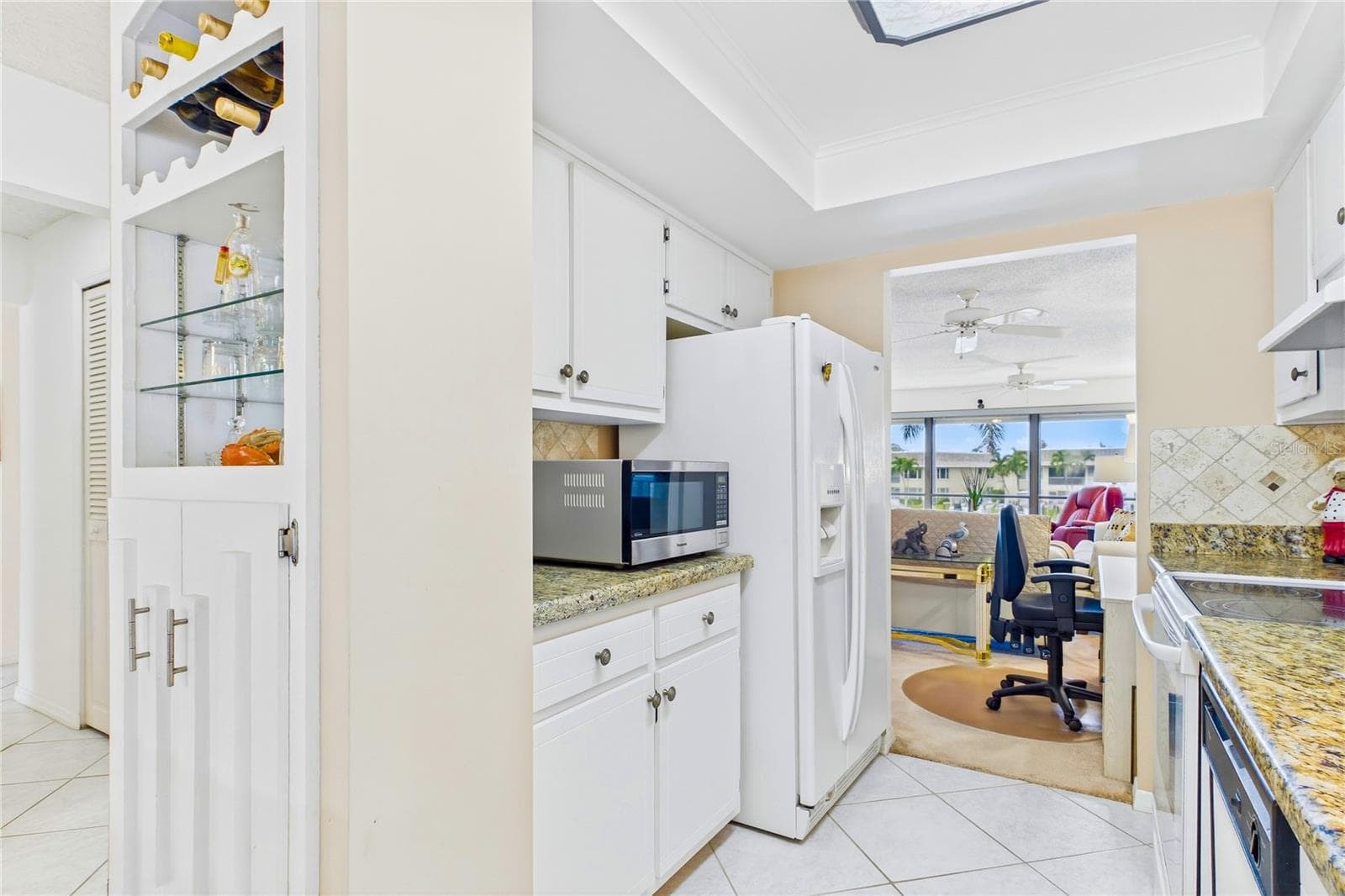 Built-in glass display and wine storage add charm and function - 4218 SE 20TH PL #D5, CAPE CORAL