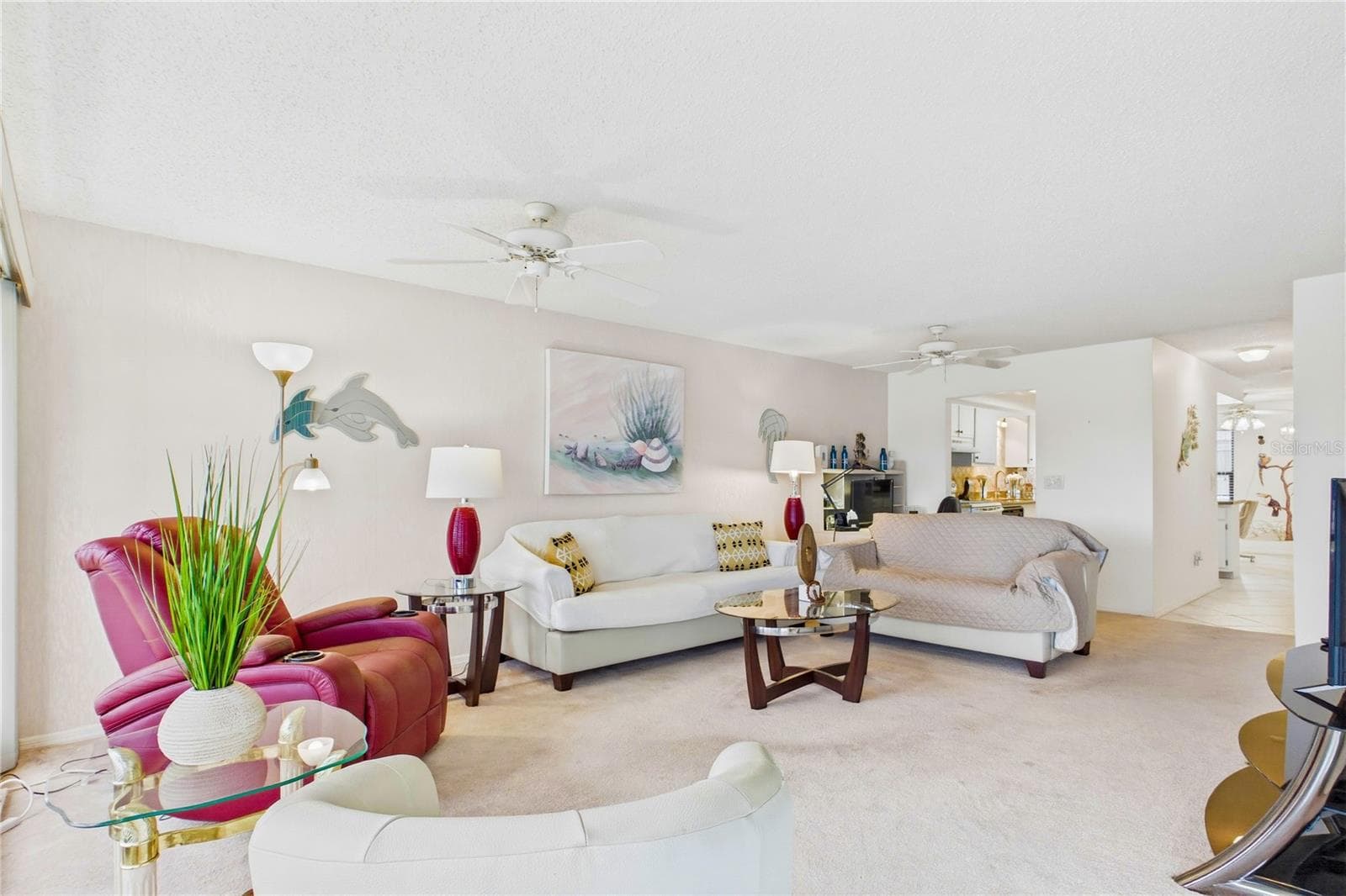 Inside, the condo features an OPEN AND AIRY FLOOR PLAN with a tasteful blend of tile and carpet flooring - 4218 SE 20TH PL #D5, CAPE CORAL