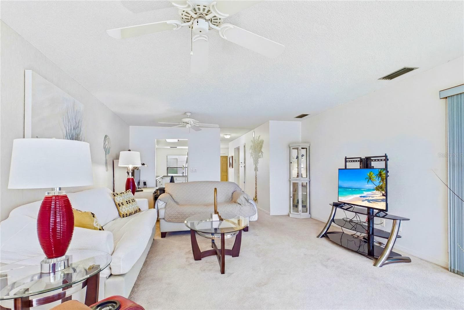The spacious living room offers a bright, comfortable setting for everyday relaxation and entertaining - 4218 SE 20TH PL #D5, CAPE CORAL