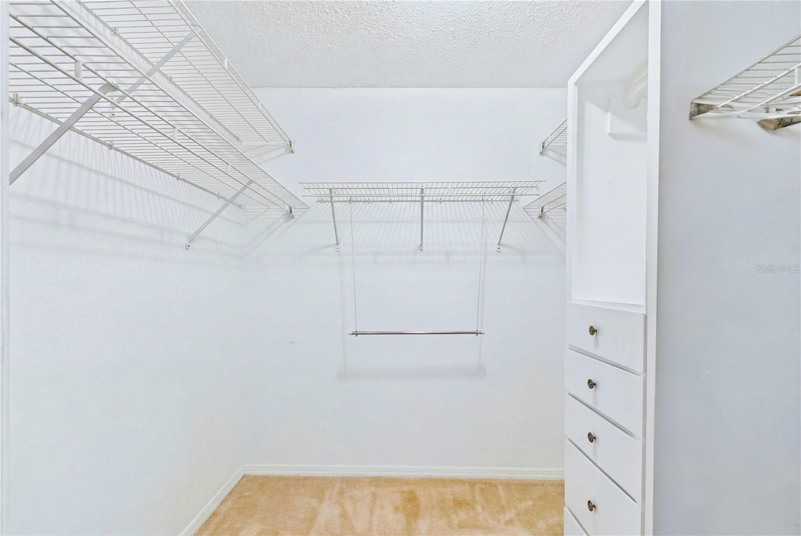 The SPACIOUS PRIMARY SUITE features a WALK-IN CLOSET - 4218 SE 20TH PL #D5, CAPE CORAL