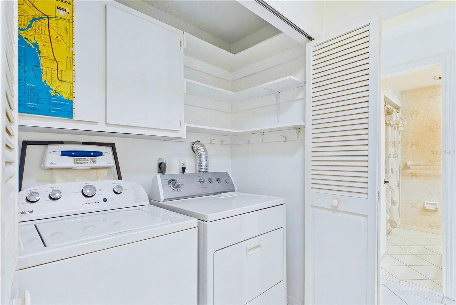 A full-sized washer and dryer are conveniently tucked inside the unit. - 4218 SE 20TH PL #D5, CAPE CORAL