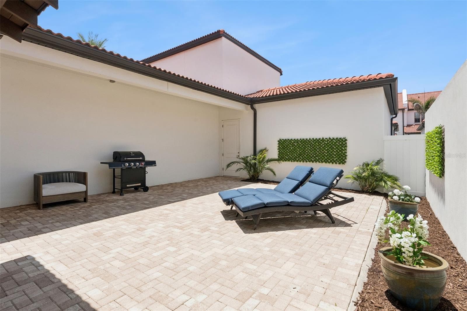 Patio view from kitchen - 8932 BISMARCK PALM DR, WINTER GARDEN