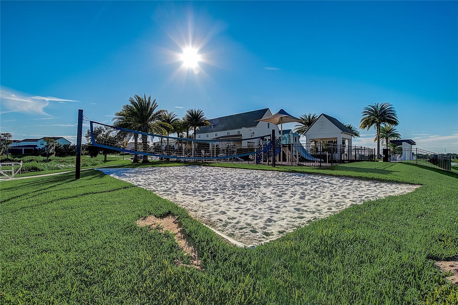 Volleyball court overlooking the lake for residents - 8932 BISMARCK PALM DR, WINTER GARDEN