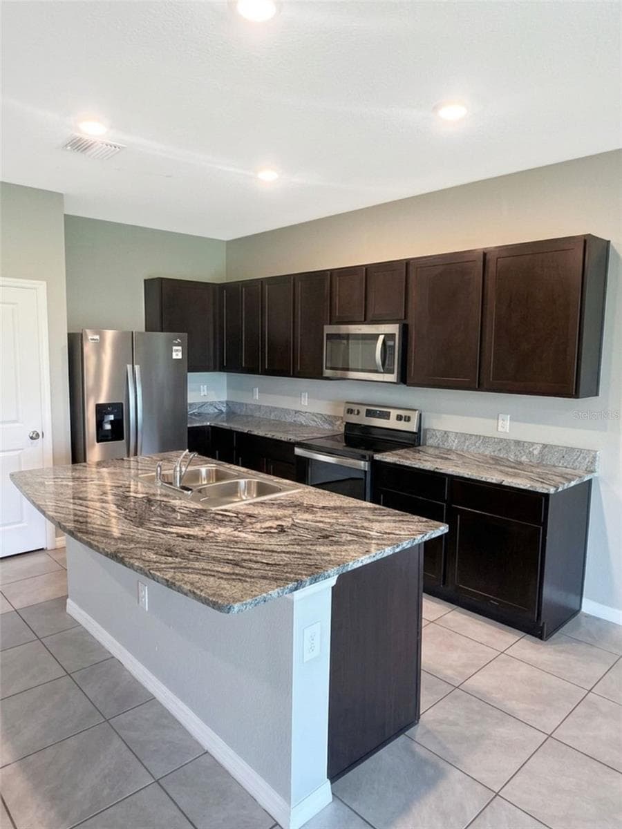 Kitchen view - 5254 DRAGONFLY DR, WILDWOOD