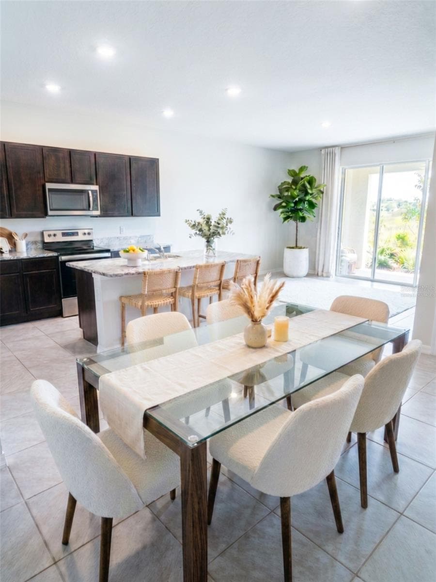 Dining area virtually staged - 5254 DRAGONFLY DR, WILDWOOD