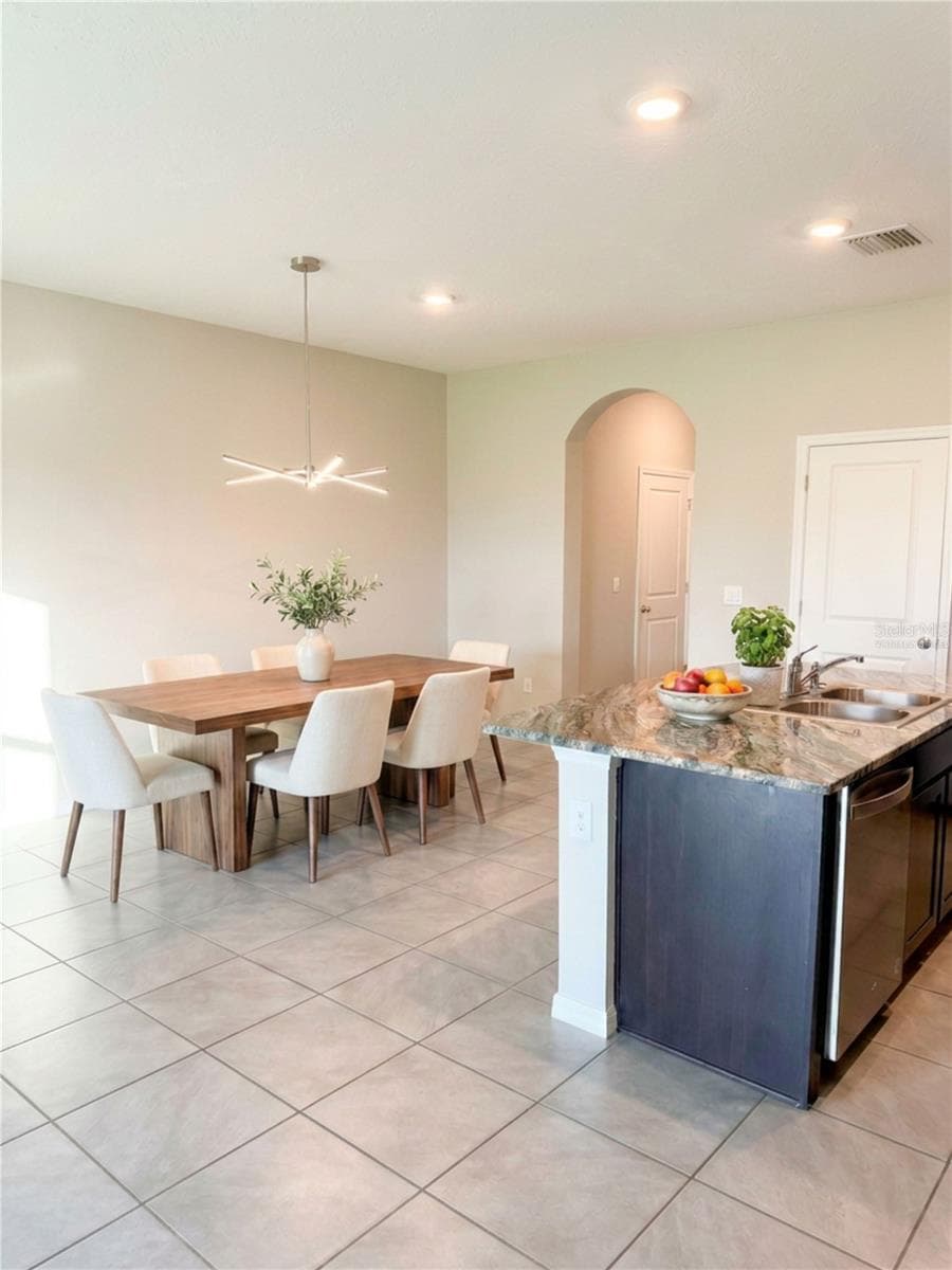 Dining room virtually staged - 5254 DRAGONFLY DR, WILDWOOD