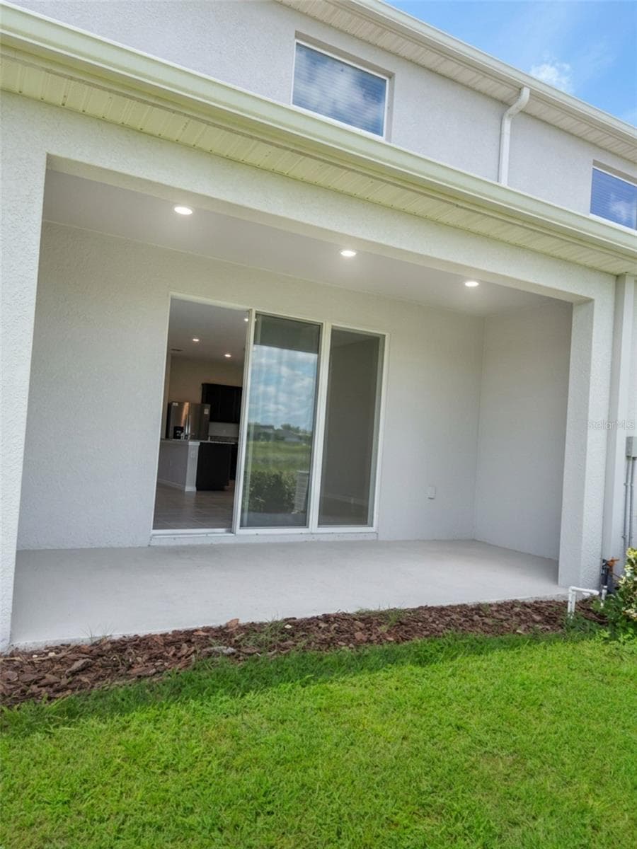Back lanai - 5254 DRAGONFLY DR, WILDWOOD