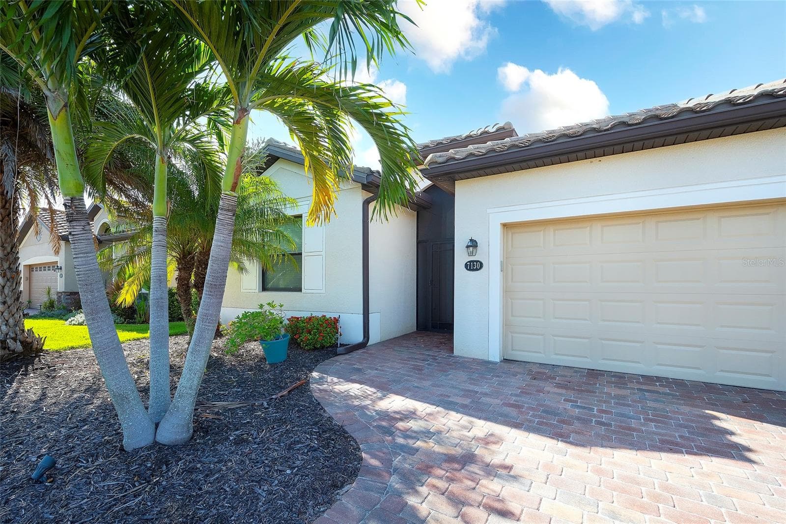 Paver Driveway & Two-Car Garage - 7130 QUIET CREEK DR, BRADENTON