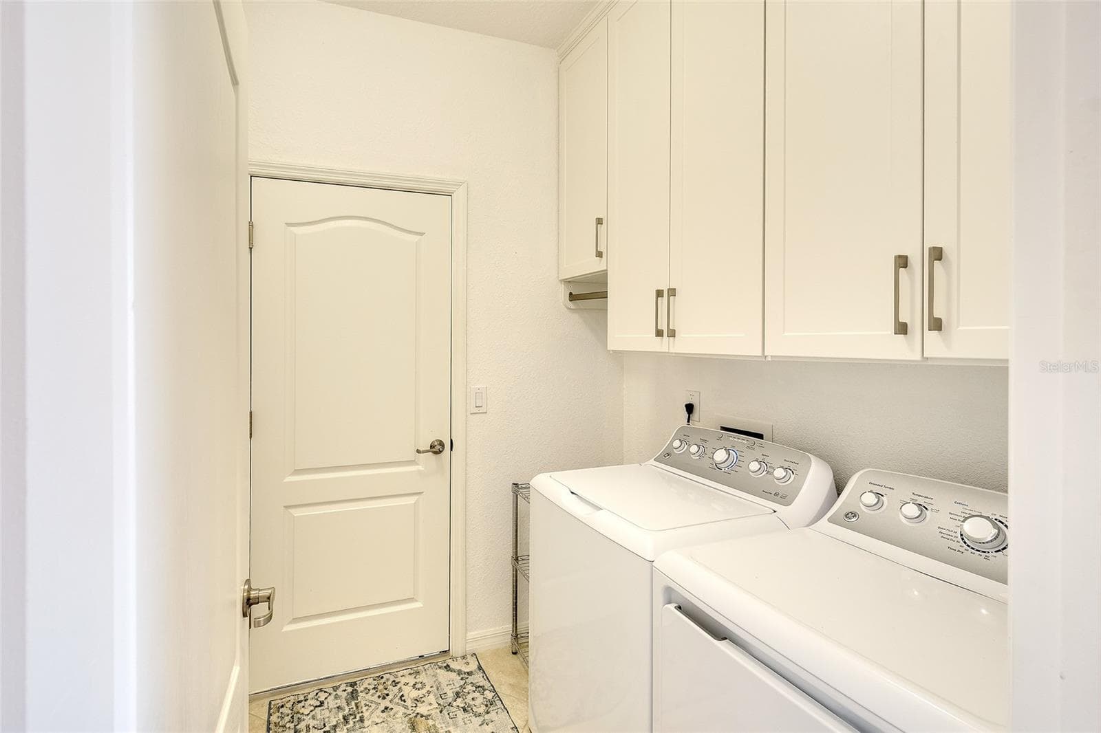 Laundry Room with Custom Cabinetry - 7130 QUIET CREEK DR, BRADENTON