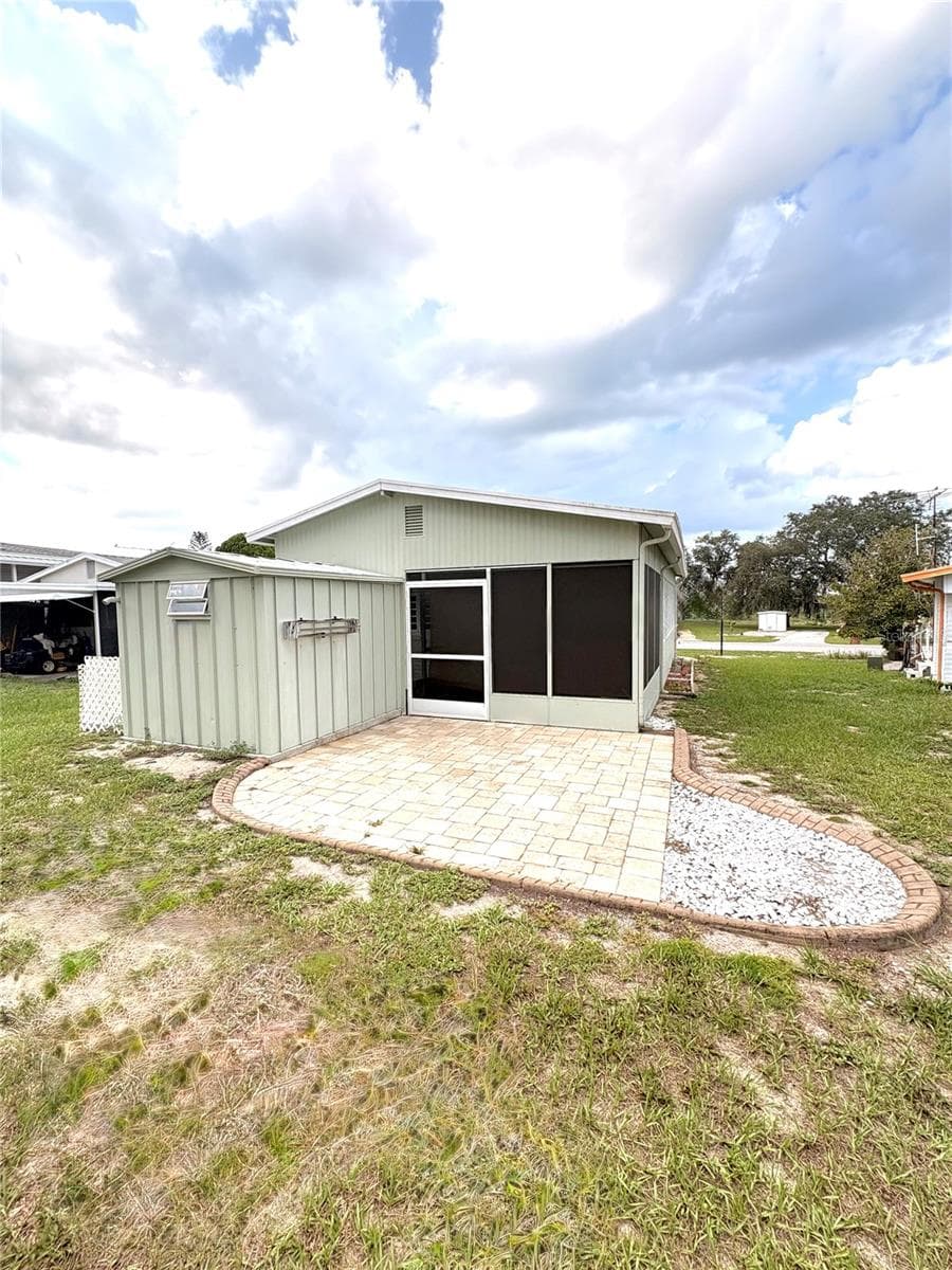 Back of Home and Porch - 117 SADDLEBAG TRL, LAKE WALES