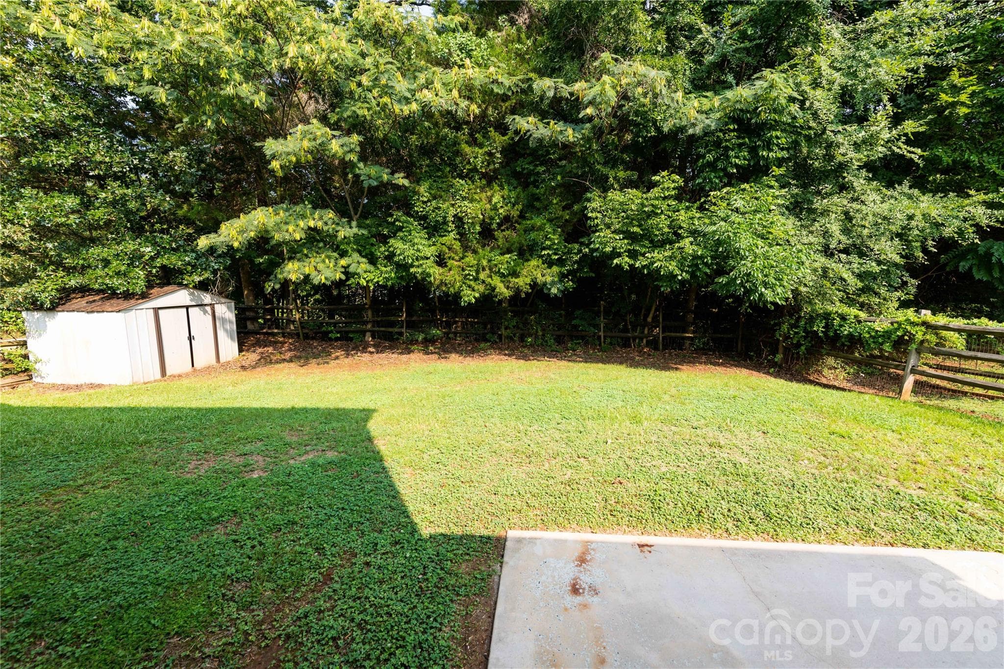 Large private backyard with split rail fencing - 266 Kendra Drive SW, Concord