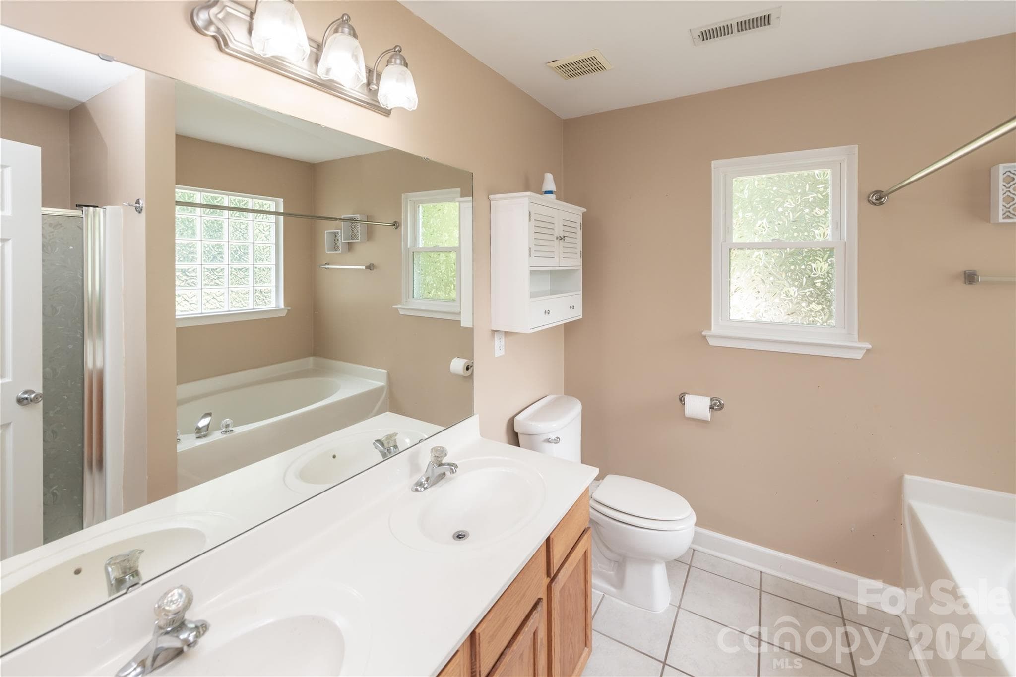 Dual vanity bathroom with walk-in shower and soaking tub - 266 Kendra Drive SW, Concord