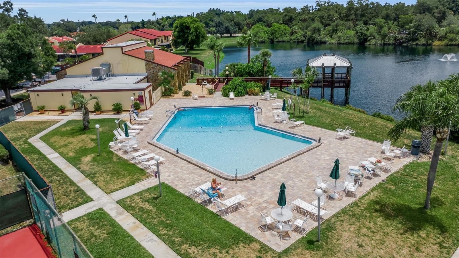 Heated pool overlooking the lake with gazebo. - 1409 56TH ST W #1409, BRADENTON