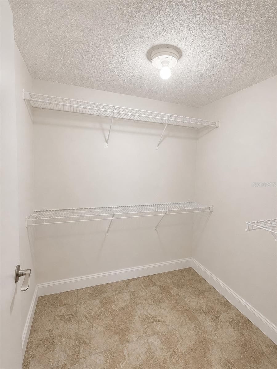Primary Walkin Closet - 1 KEY CAPRI #102W, TREASURE ISLAND