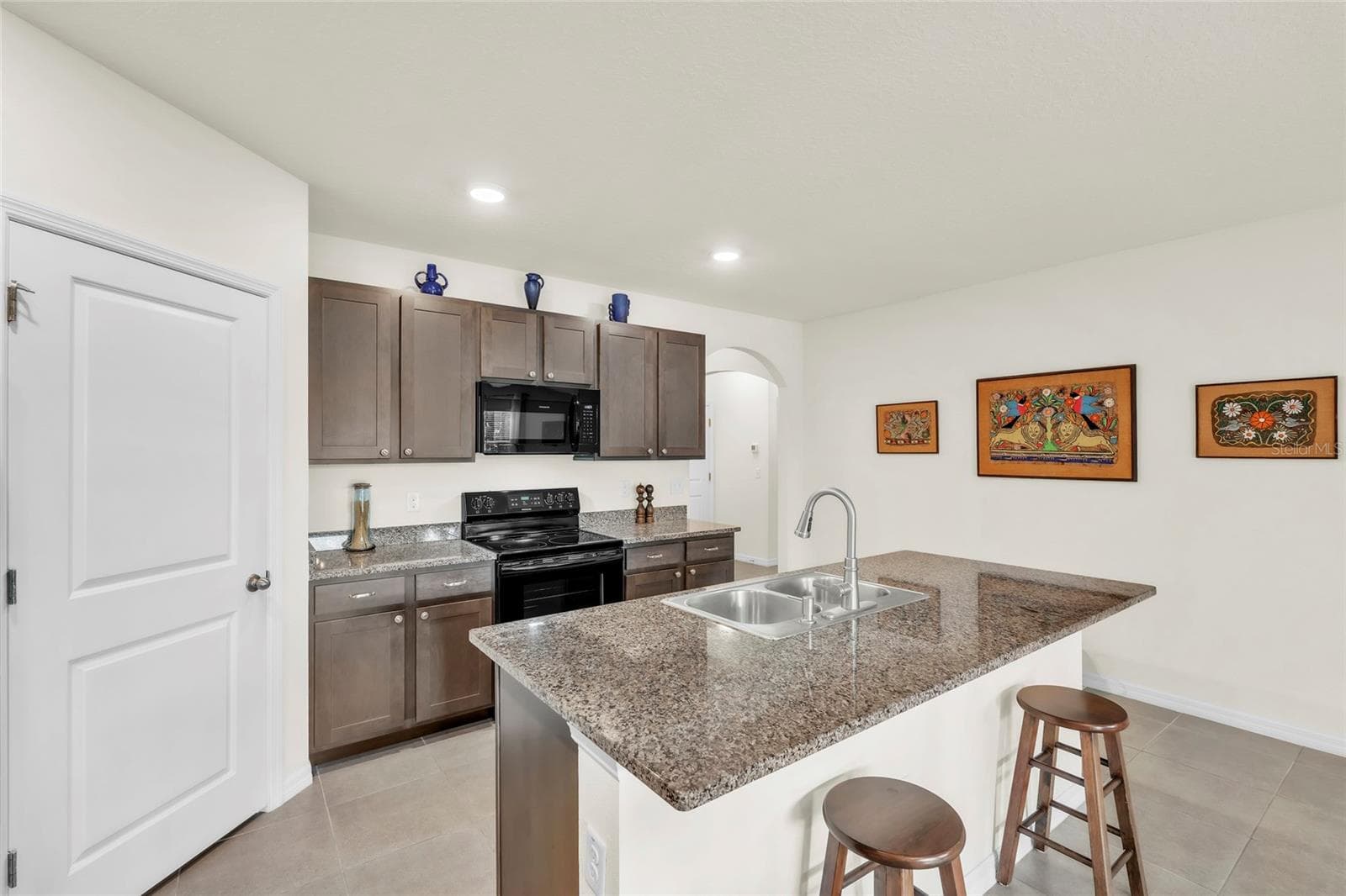 The heart of the home, ready for your first meal. - 9527 SUNSTONE BLVD, THONOTOSASSA