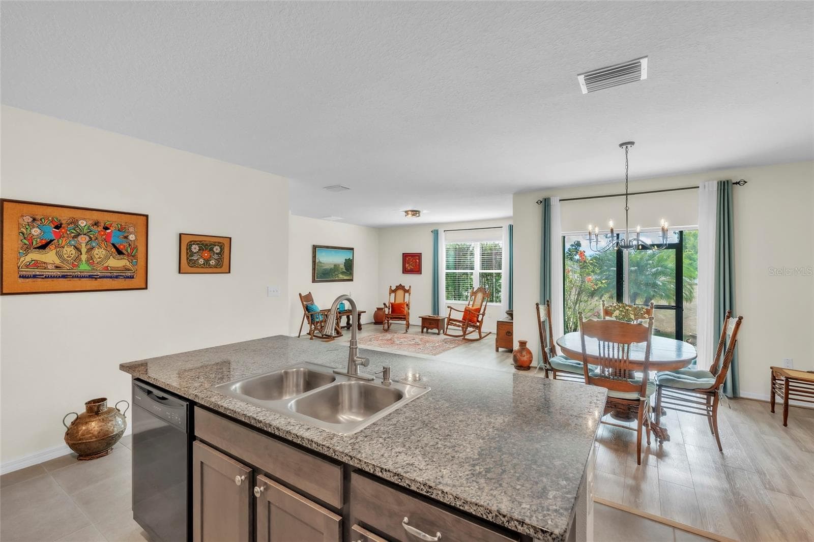 Open concept living. Room to live, entertain, and breathe. - 9527 SUNSTONE BLVD, THONOTOSASSA