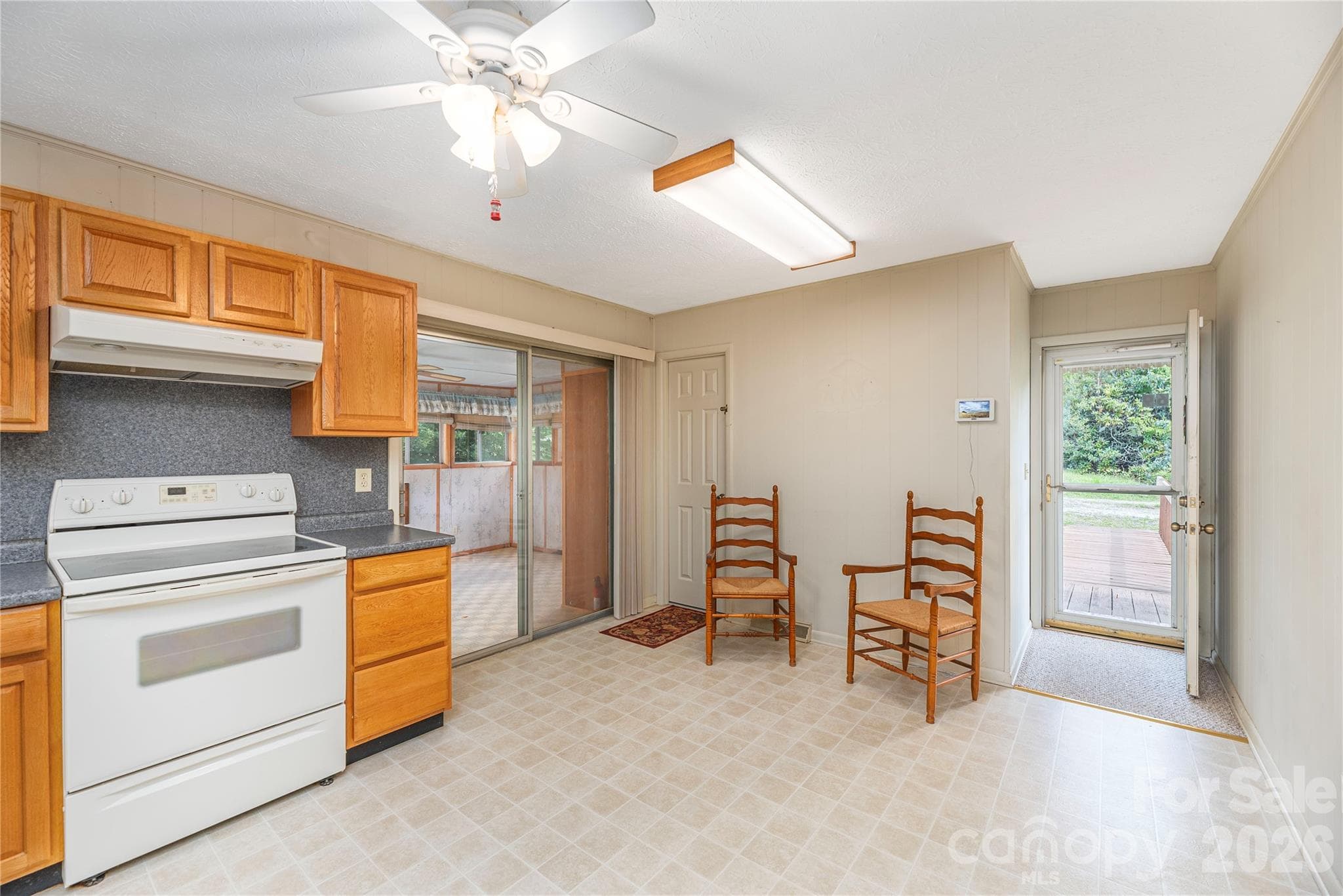 Sunroom off kitchen can be used as larger dining room or extra sitting area. - 69 Emerald Lane, Hendersonville