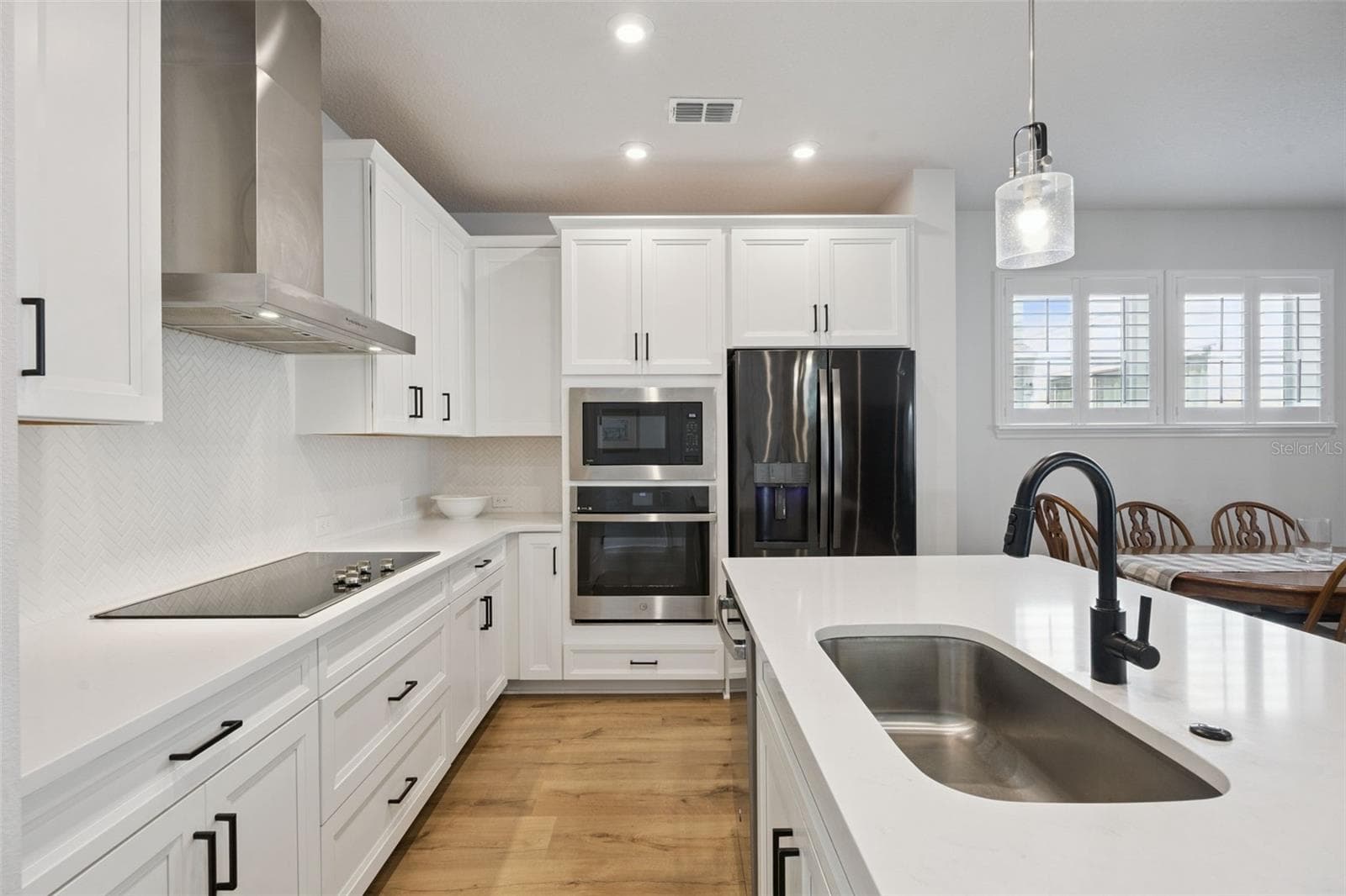 Gourmet Kitchen features Stainless Double Microwave/Convection oven with 5-Burner Cooktop and True Vented Hood. - 2954 JOURNEY PL, ST CLOUD