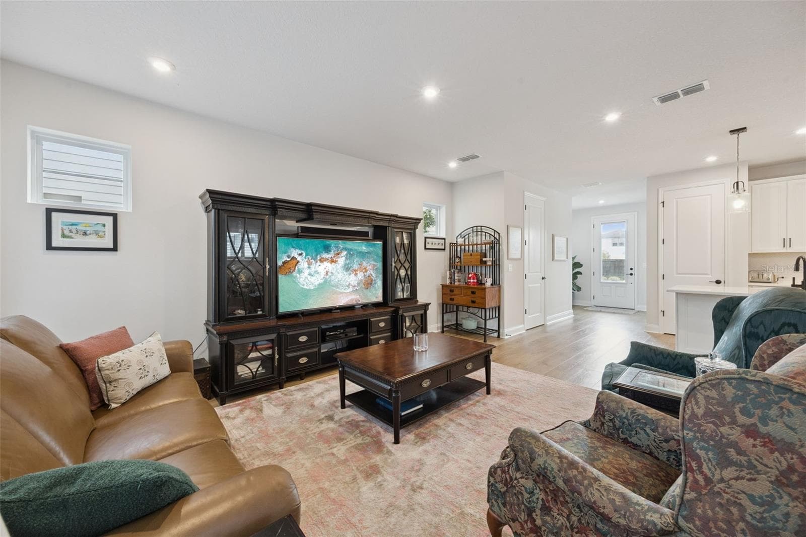 This comfortable Family Room offers plenty of room for relaxing, entertaining, and everyday living. - 2954 JOURNEY PL, ST CLOUD