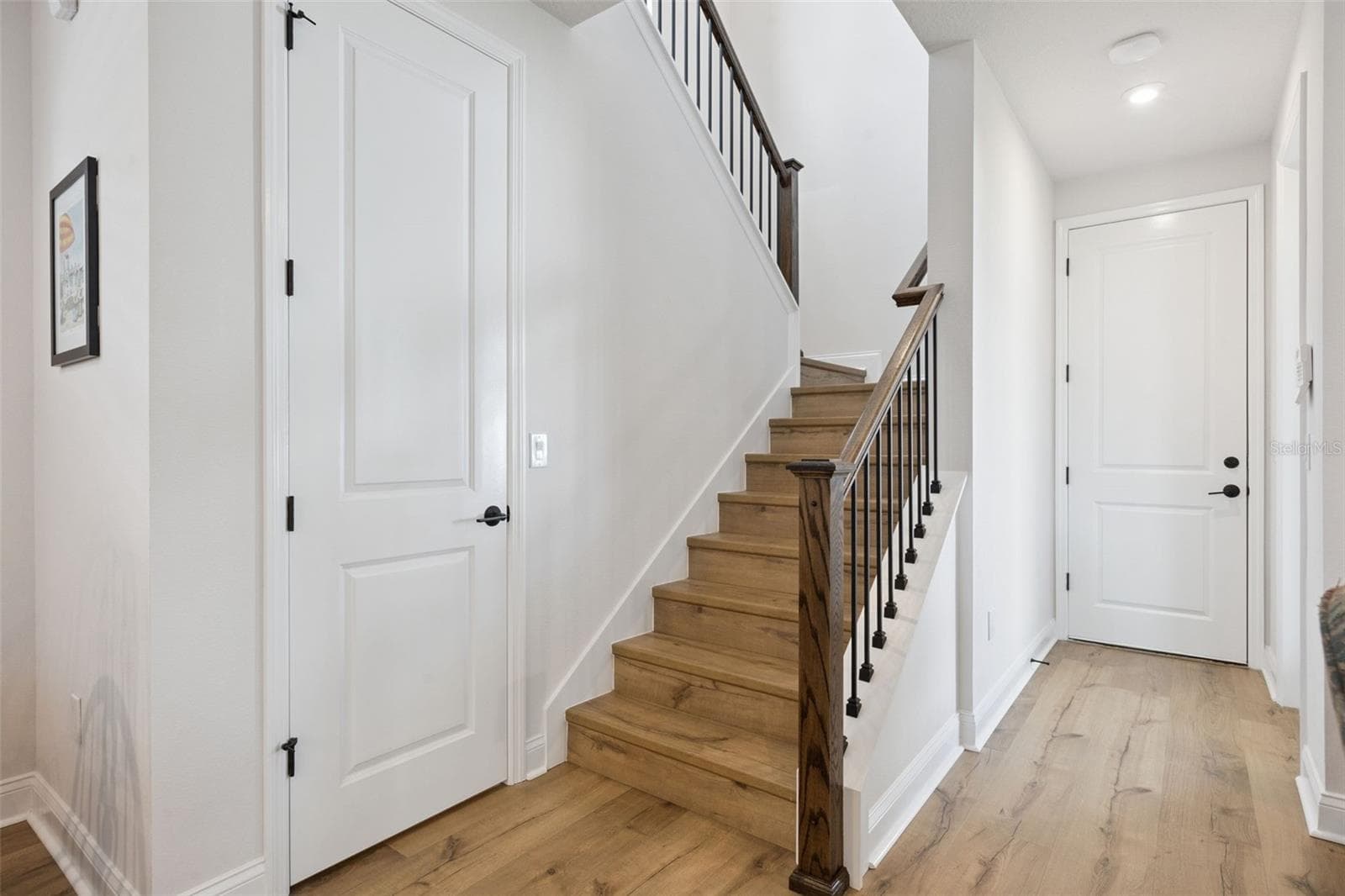Pantry, Stairway and Entry door to the 3 car garage, Entry door to the Covered Porch. 5-1/4 baseboards throughout the home. - 2954 JOURNEY PL, ST CLOUD