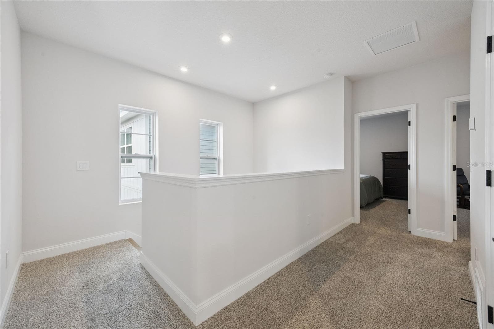 Welcome to the 2nd level where you'll find the Owners Retreat, Laundry Room, Bonus Loft, Secondary Bedrooms, Secondary Bath and wall to wall Mohwawk Carpet. - 2954 JOURNEY PL, ST CLOUD