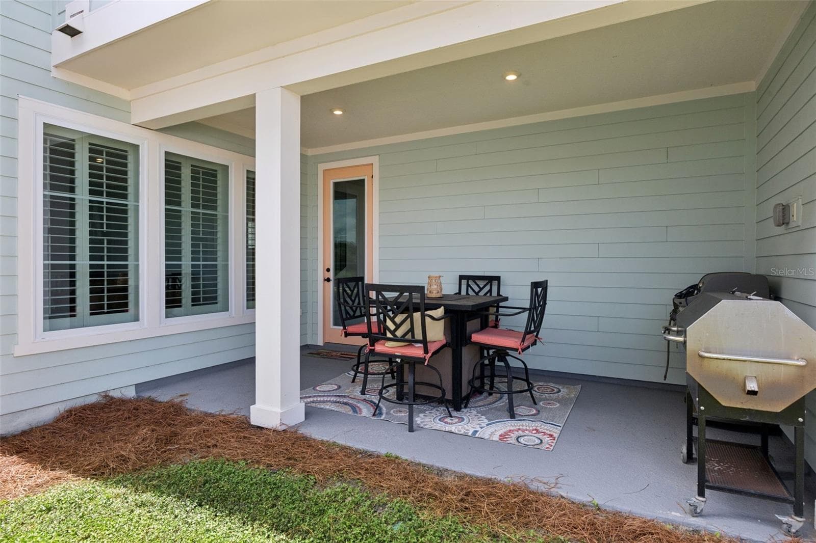Enjoy a cool beverage as the Sun Sets on this cozy covered Porch. - 2954 JOURNEY PL, ST CLOUD