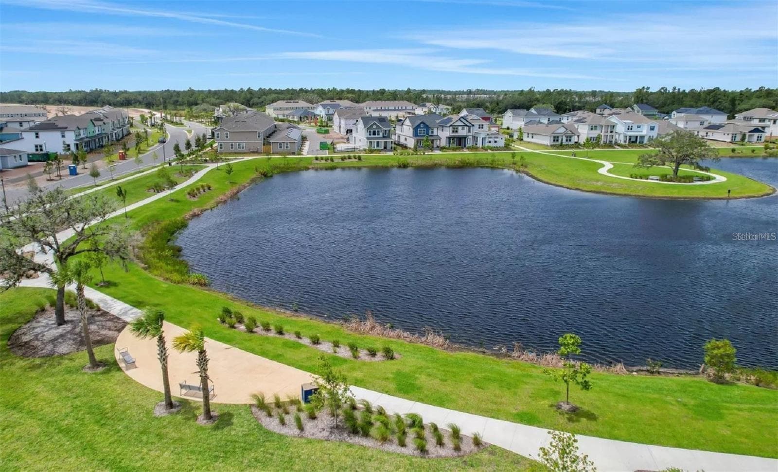 Walking Trail surrounds the oversized pond. - 2954 JOURNEY PL, ST CLOUD