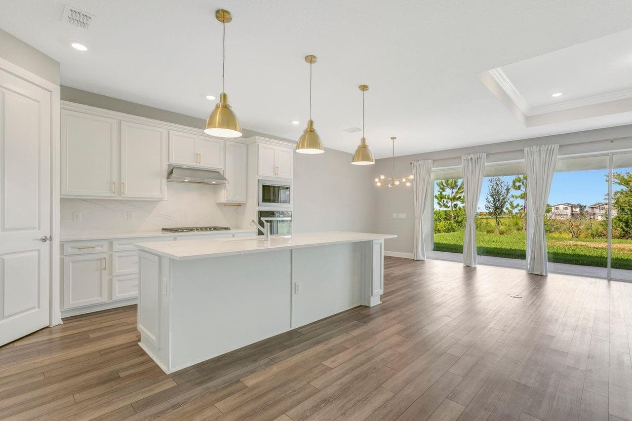 Luxury Kitchen with Large island, built in oven, closet pantry, custom fixtures, solid backsplash - 9909 LONGMEADOW AVE, PARRISH