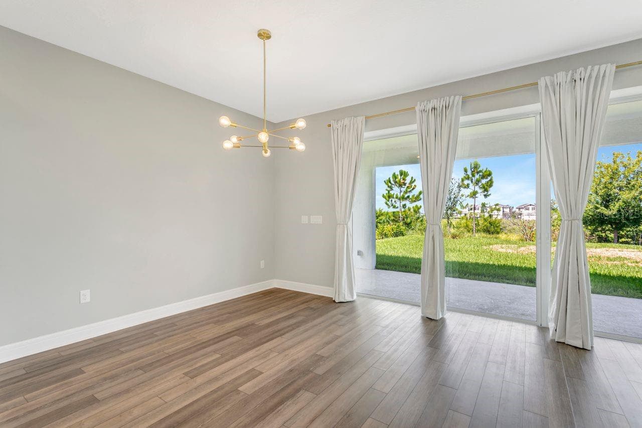 Diningroom adjacent to the kitchen with lots of natural light and backyard views - 9909 LONGMEADOW AVE, PARRISH